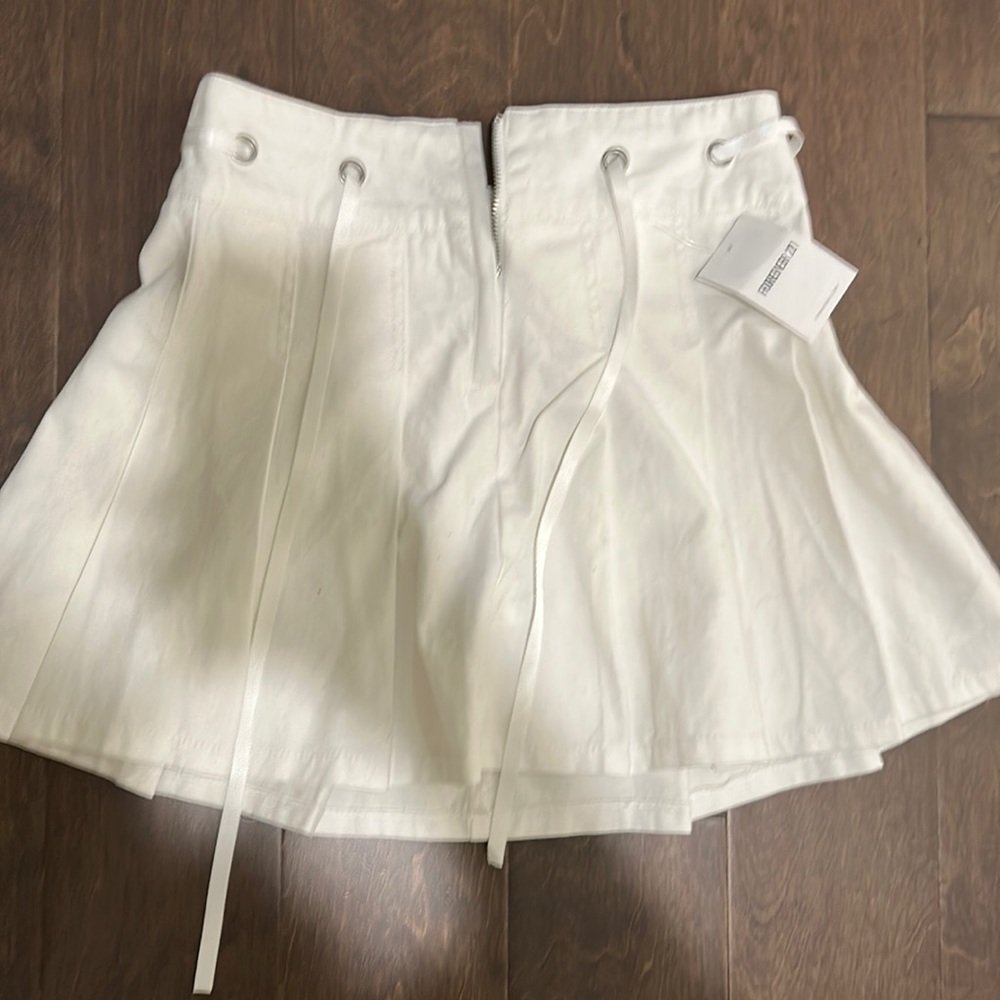 A marble blue and white crop top. A pretty white skirt.